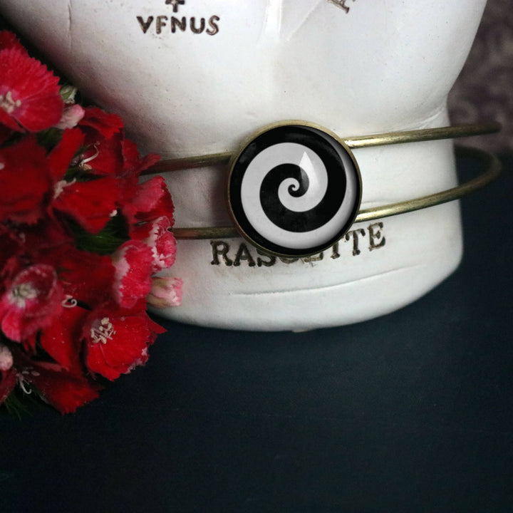 The Divine Iguana - Black and White Spiral Glass Cabochon Cuff Bracelet